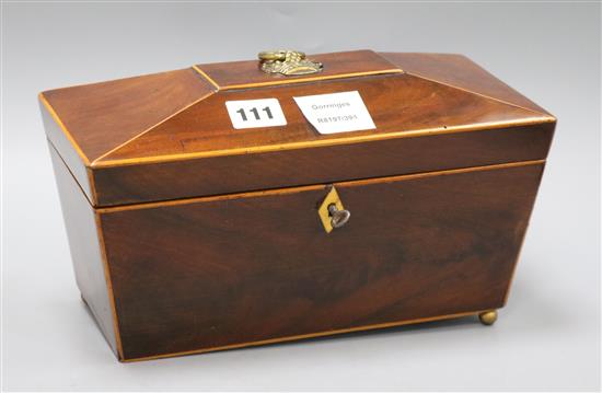 A Victorian inlaid mahogany sarcophagus shaped tea caddy length 28cm, missing one foot